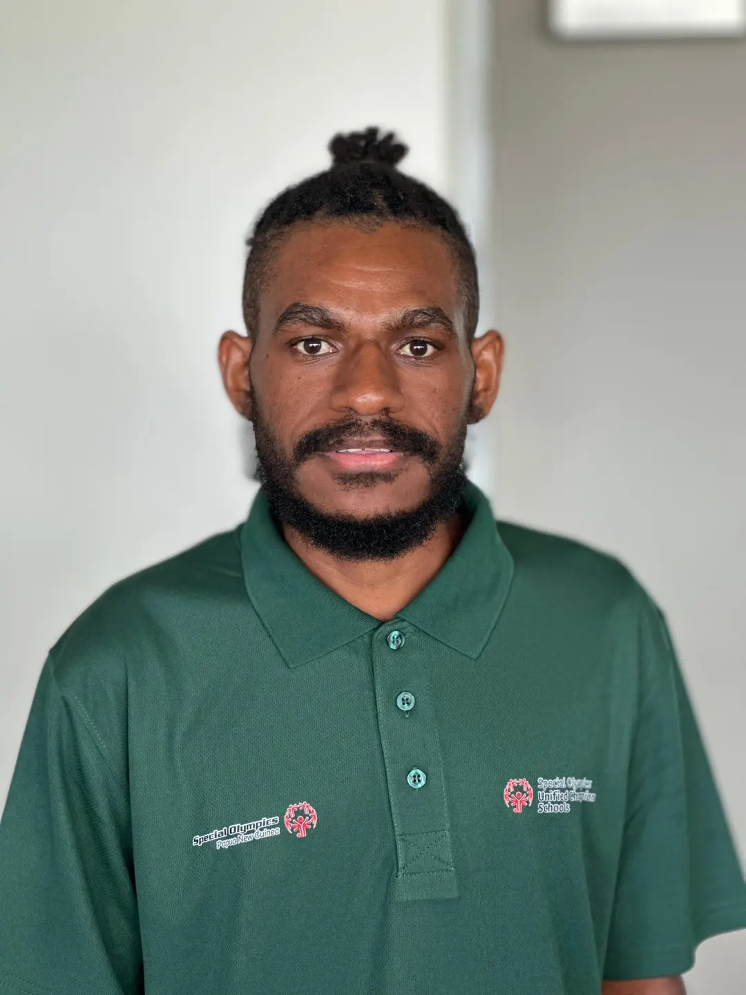 Volunteer portrait; name and position to be added.