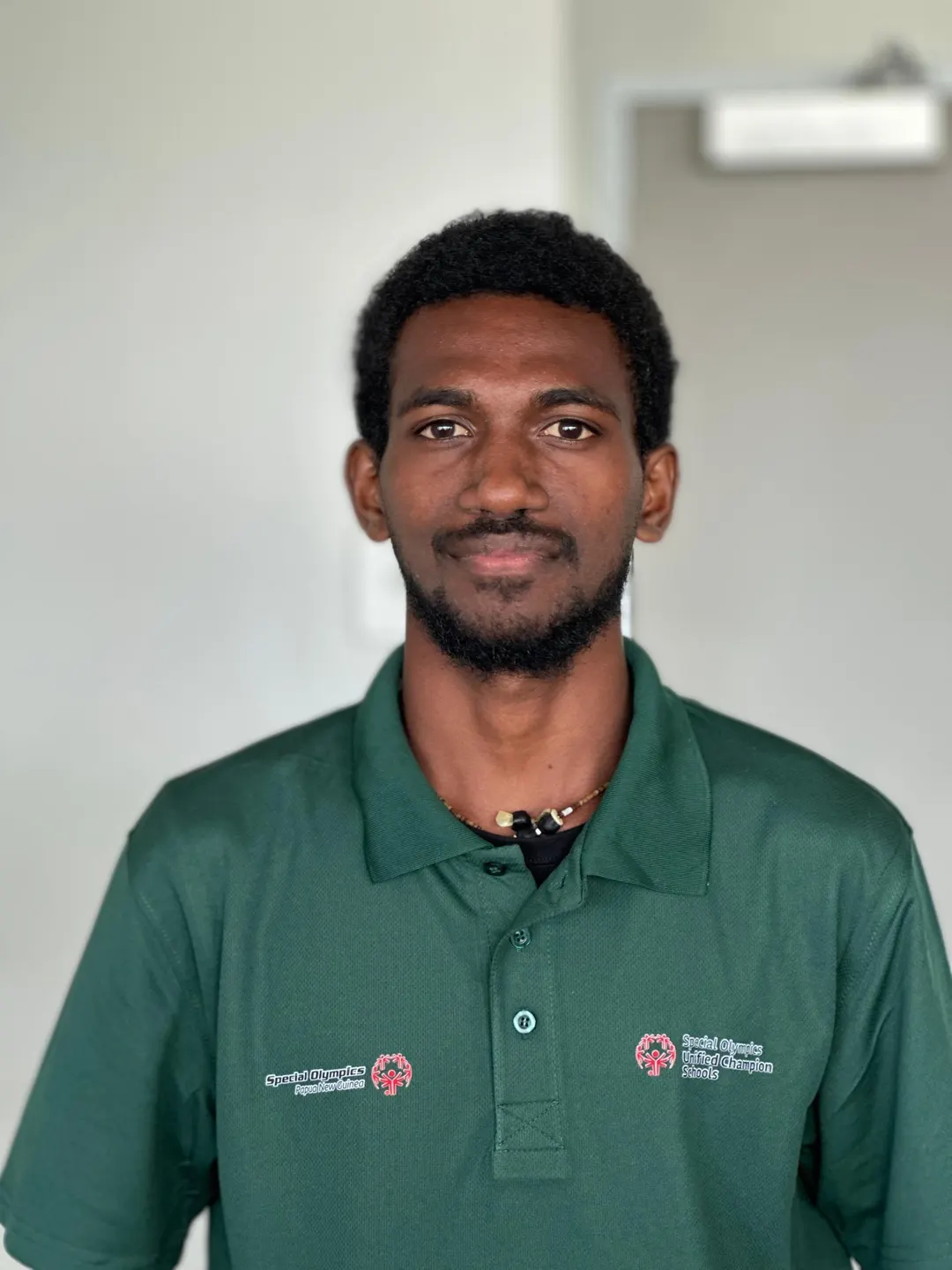 Volunteer portrait; name and position to be added.
