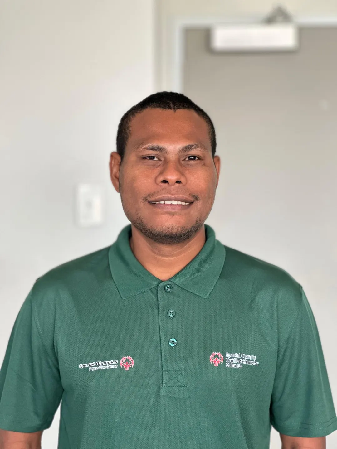 Volunteer portrait; name and position to be added.