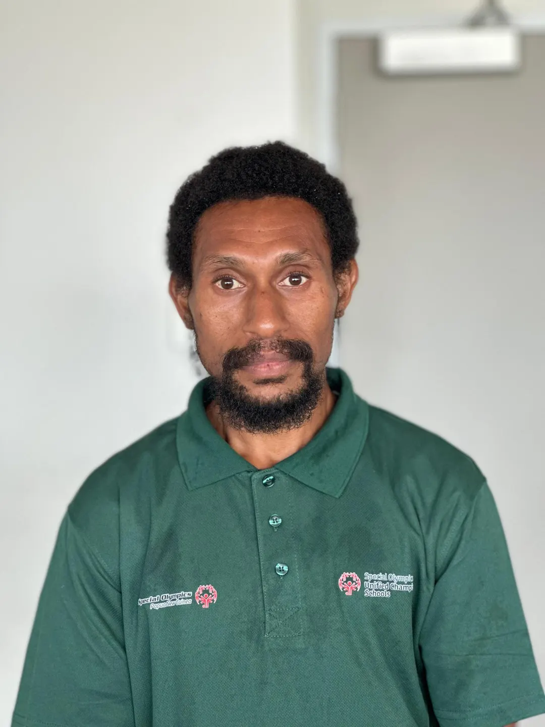 Volunteer portrait; name and position to be added.